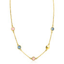 Vergoldete Kette mit bunten Steinen in rosa und blau, feine Glieder und runde Anhänger.