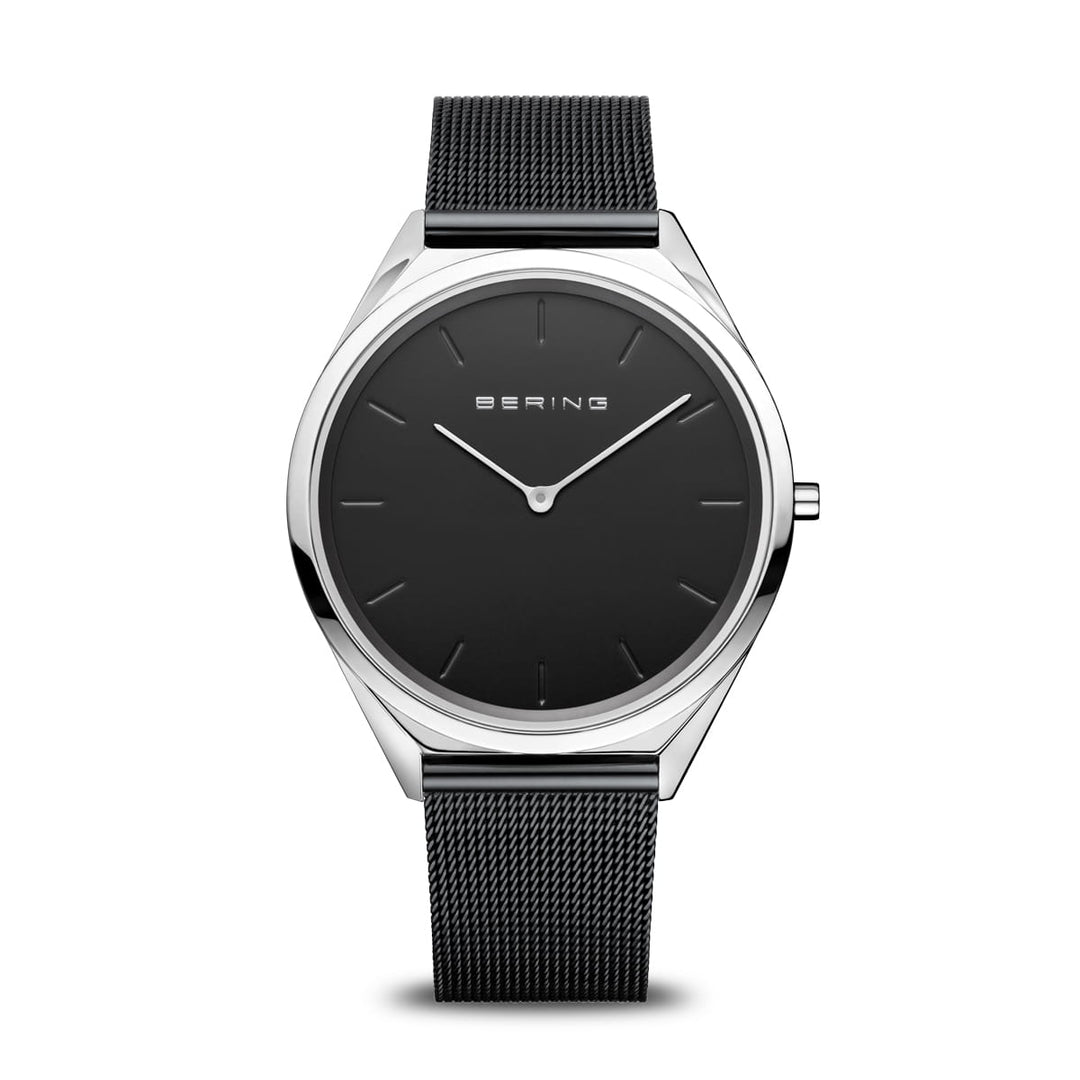 Ontdek het Bering Unisex Horloge, 17039-102, met een strakke zwarte mesh band en minimalistische wijzerplaat gemaakt van robuust roestvrij staal. Het dunne zilveren frame met eenvoudige markeringen en wijzers wordt beschermd door saffierglas, met Bering elegant weergegeven op de zwarte wijzerplaat.