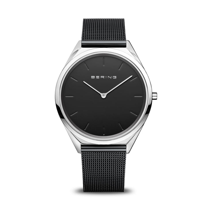 Ontdek het Bering Unisex Horloge, 17039-102, met een strakke zwarte mesh band en minimalistische wijzerplaat gemaakt van robuust roestvrij staal. Het dunne zilveren frame met eenvoudige markeringen en wijzers wordt beschermd door saffierglas, met Bering elegant weergegeven op de zwarte wijzerplaat.