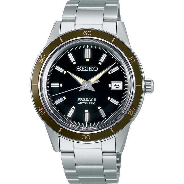 Het Seiko Presage heren horloge SRPG07J1 heeft een automatisch uurwerk, een zwarte wijzerplaat met zilveren uurmarkeringen, een datumvenster op 3 uur en een bruine lunette met minutenmarkeringen. Het wordt geleverd met een strakke zilveren metalen band.
