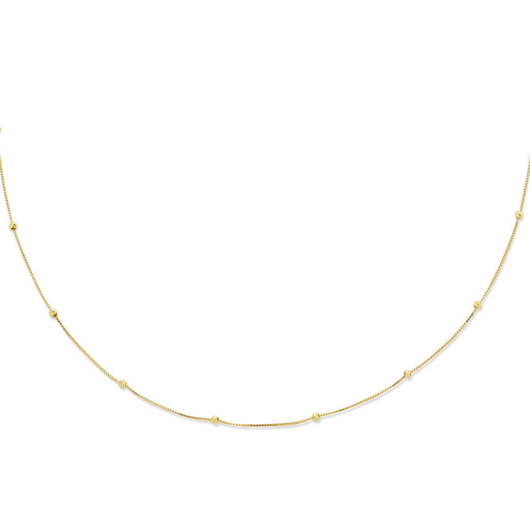 Stijlvol gepresenteerd: Van der Kooij Collectie collier bolletjes gediamanteerd 0,5 mm van 14K geelgoud (42-45 cm) met kleine gouden kraaltjes, mooi verdeeld over de lengte op een witte achtergrond.