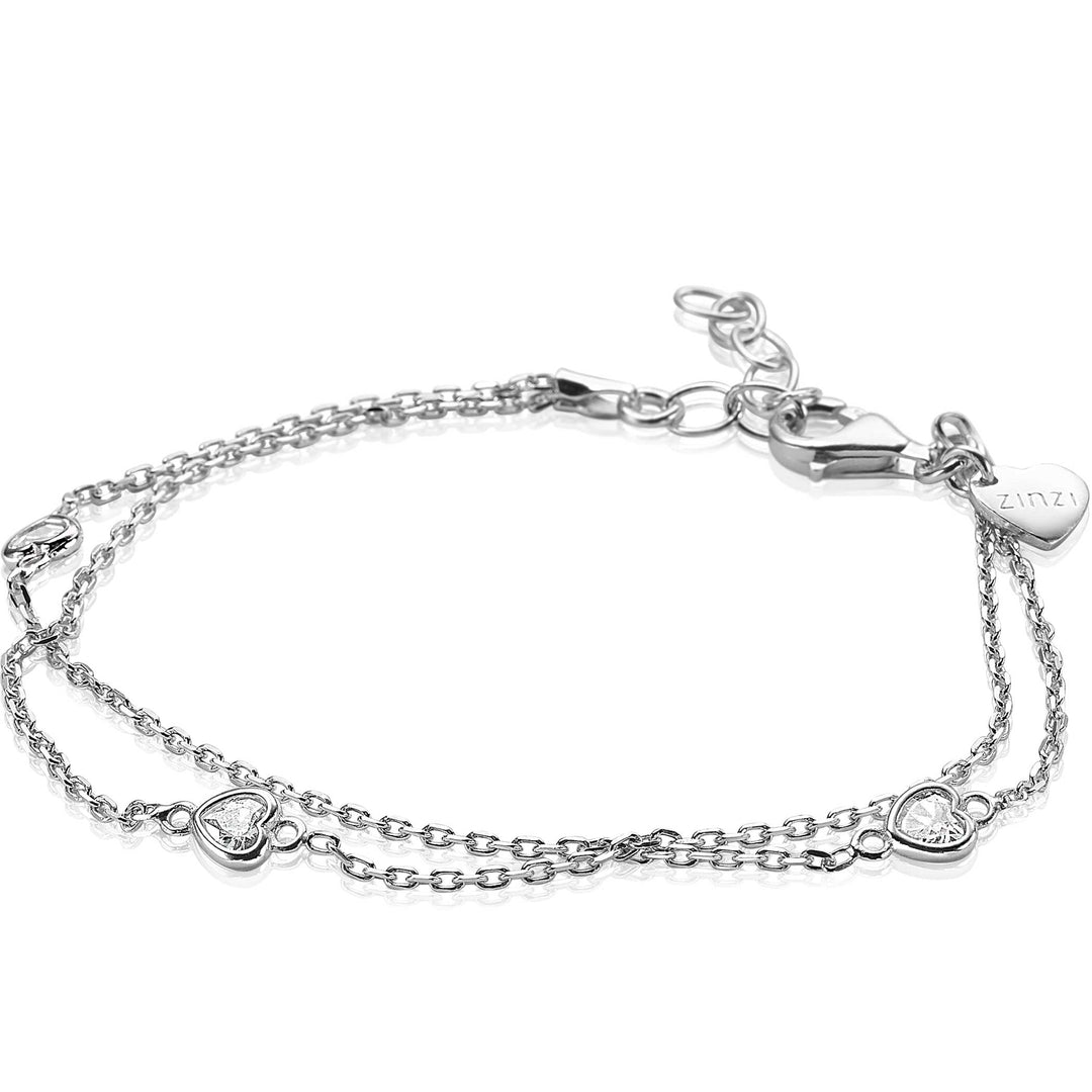 Ontdek de Zinzi Armband Zilver Zia1721, een delicate zilveren armband van Zinzi met een dubbel hartje design. Het heeft kleine hartjes bedels op een verstelbare dubbele ketting, één gegraveerd en de andere versierd met een heldere edelsteen.