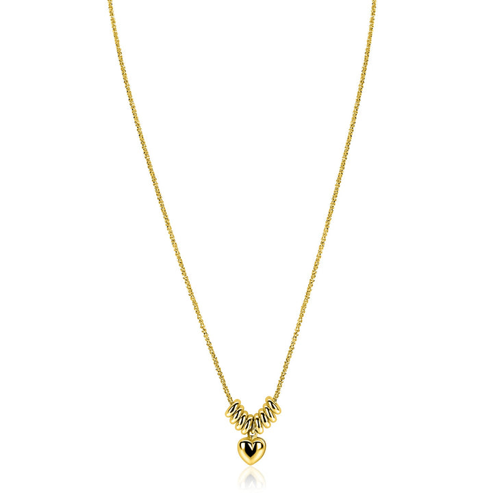 De Zinzi ketting ZIC2760 is een vergulde ketting van Zinzi, met vijf zilveren spiraalkralen en een gouden hartjeshanger met een zwarte V. Tegen een effen witte achtergrond is hij ideaal voor liefhebbers van subtiele hartjes kettingen.