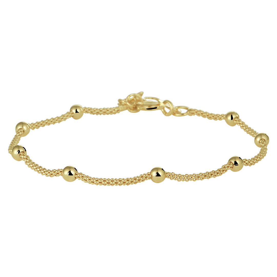 De Van der Kooij Collectie armband bolletjes 3,0 mm 17 + 2 cm is een goudkleurig dames sieraad in minimalistisch design, met een dubbele ketting, gepolijste bolletjes en sluiting; verguld met 3 micron zilver (geel).