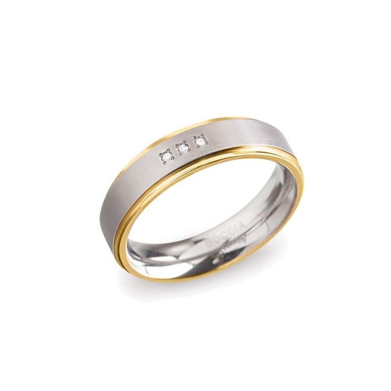 Bicolor Ring aus Titan mit silberner und goldener Oberfläche sowie drei kleinen Diamanten