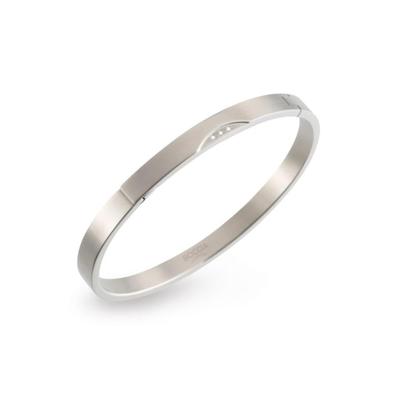 Schlichte Titan-Armband mit drei kleinen, funkelnden Steinen und mattem Finish