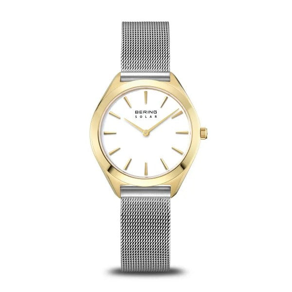 De Bering 17331-010 dameshorloge heeft een goudkleurige kast, witte wijzerplaat met gouden markers en wijzers, zilverkleurige mesh band en een saffierglazen wijzerplaat voor blijvende elegantie.