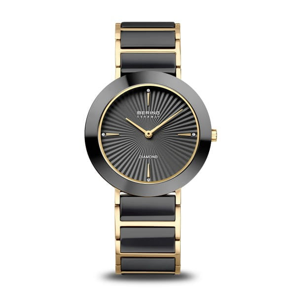 Uhr mit schwarzem Zifferblatt, goldfarbenem Gehäuse und schwarzem Armband aus Keramik und Edelstahl