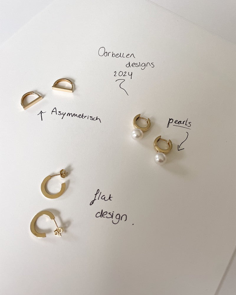 Gelbgoldene Ohrringe mit verspieltem Design – Zeitlose Eleganz
