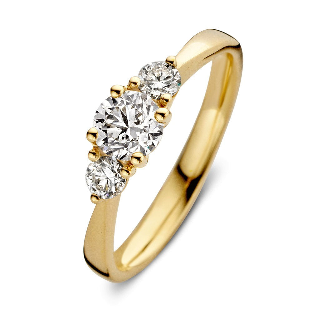 Ring aus 18 Karat Gelbgold mit drei funkelnden Diamanten in ovaler und runder Form