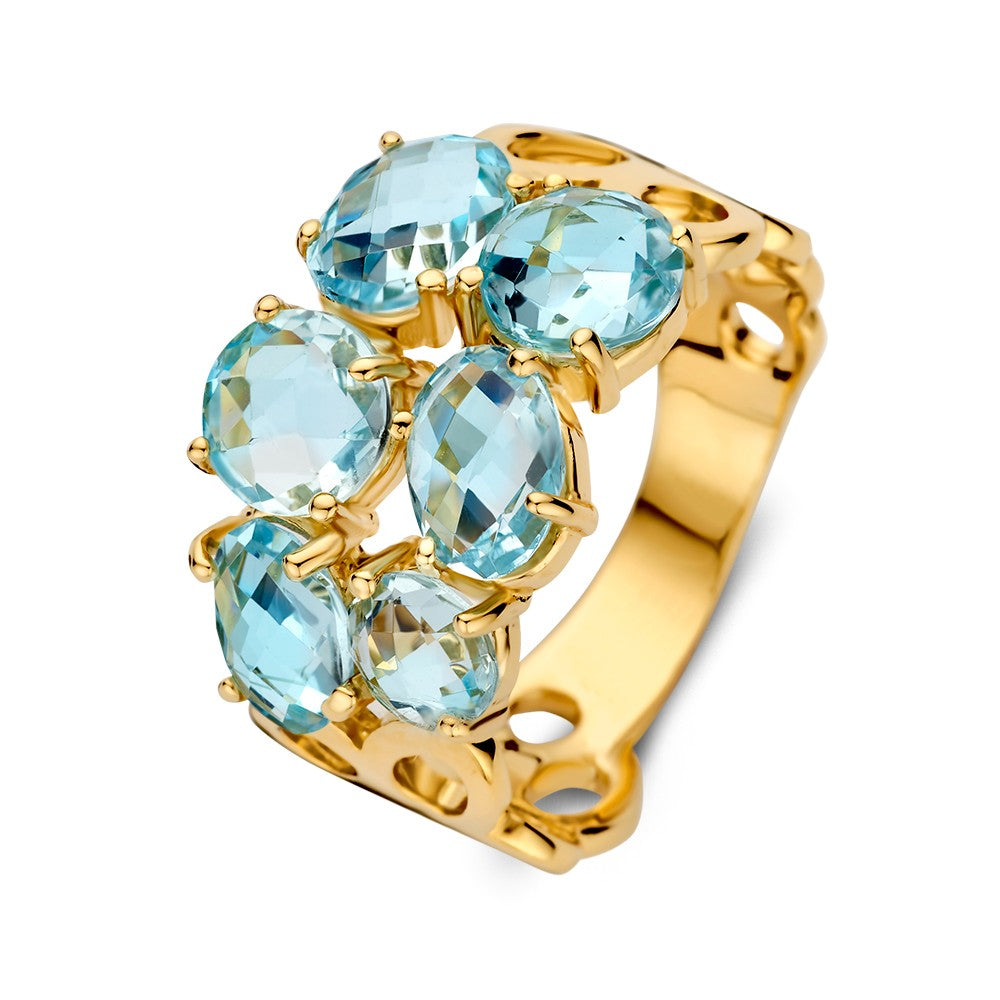 Breite gelbgoldene Ring mit mehreren blauen Topasen in organischer Fassung