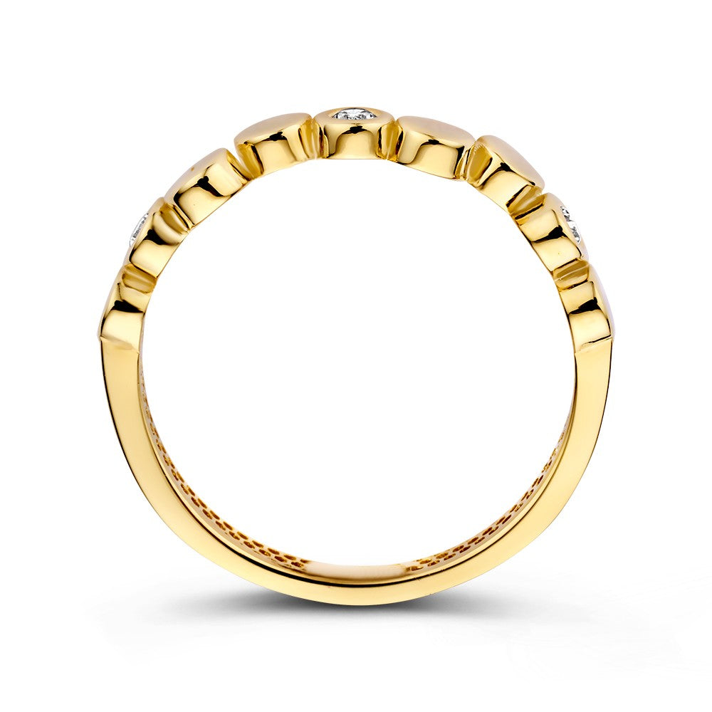 Gelbgoldener Ring mit verspielten runden Elementen und funkelnden Zirkonia