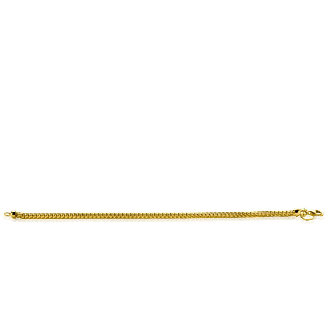 De Zinzi Armband Gold Plated Zia1287 G, afgebeeld op een witte achtergrond, toont een strakke en sierlijke vossenstaartketting met een eenvoudige sluiting. Perfect om elegantie toe te voegen aan elk mode-ensemble of sieradencollectie.