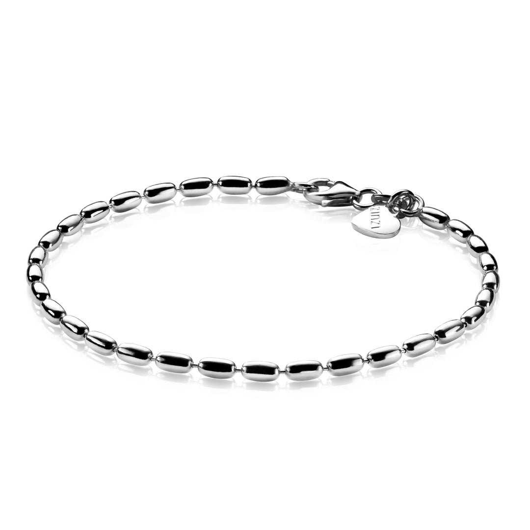 De Zinzi Armband Zilver Zia1125 is een strakke zilveren armband met kleine ovale schakels en een hartvormige gegraveerde bedel bij de sluiting, wat elegantie toevoegt. Afgebeeld op een effen witte achtergrond, is het een tijdloze keuze van het merk Zinzi.