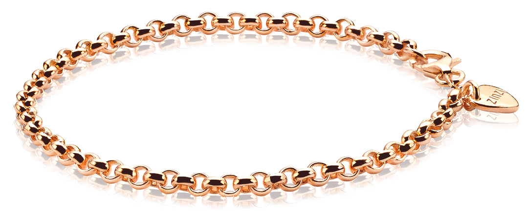 De Zinzi Armband Gold Plated Zia1009 R is een prachtig sieraad met in elkaar grijpende roségouden schakels en een hartvormig bedeltje met de gravure 1112, elegant rosé verguld.