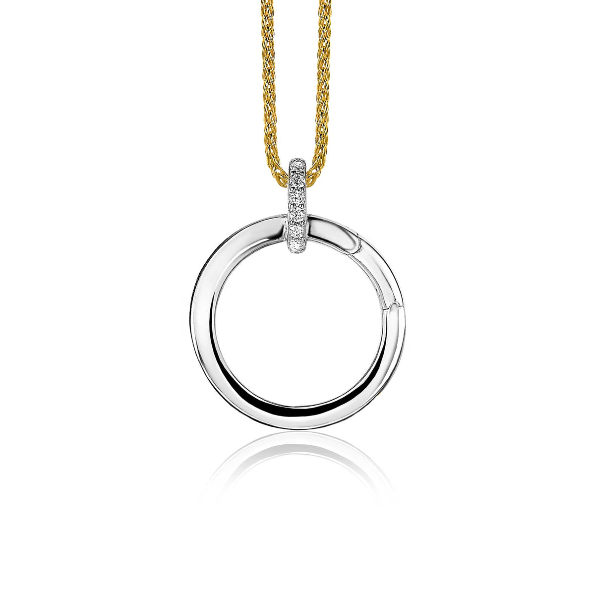 Hänger aus Silber mit einem runden Anhänger und drei kleinen Edelsteinen, an einer goldenen Kette