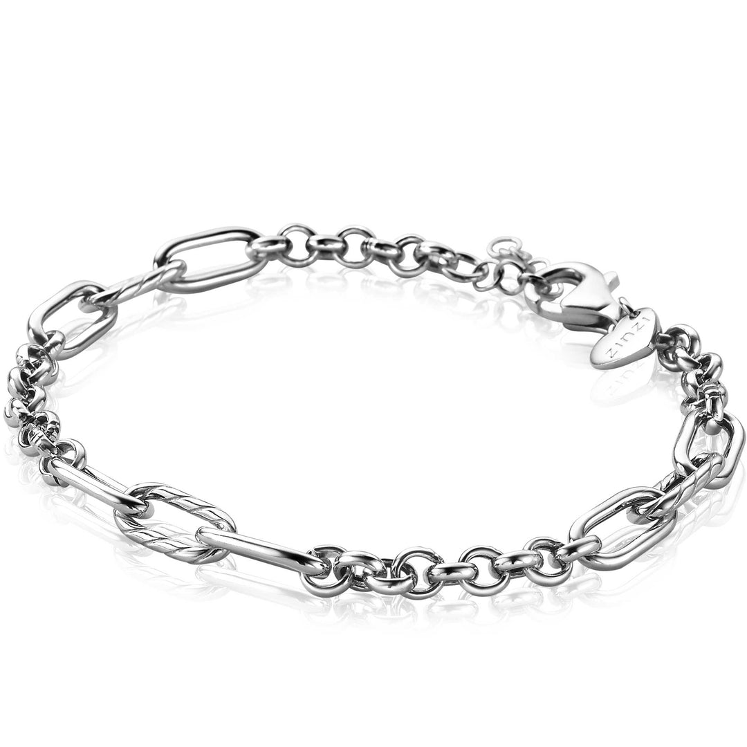 De Zinzi Armband Zilver Zia2205 heeft een verbluffende zilveren ketting met een mix van ronde en ovale schakels, versterkt door getextureerde langwerpige schakels. Het is vastgezet met een karabijnsluiting en reflecteert elegant op een ongerept wit oppervlak.