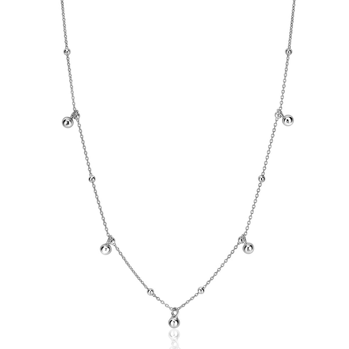 Kette aus Silber mit runden, schimmernden Perlen in verschiedenen Abständen