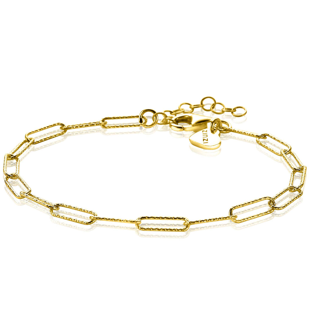 De Zinzi Armband Gold Plated Zia1992 G is een delicate armband met 14K vergulde paperclipschakels met een klein hartje en een verstelbare sluiting, die elegantie uitstraalt.