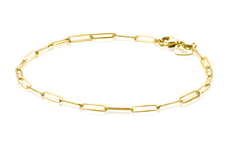 Zinzi Armband Goud Zga296 heeft langwerpige ovale schakels die lijken op paperclip-schakels en een sluiting tegen een witte achtergrond. Een klein hartvormig label is bevestigd bij de Zinzi-sluiting.