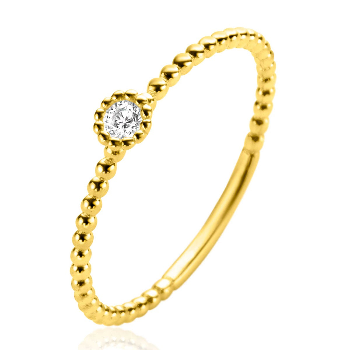Ring aus Gold mit einem runden, klaren Edelstein und einer strukturierten, perlenartigen Oberfläche