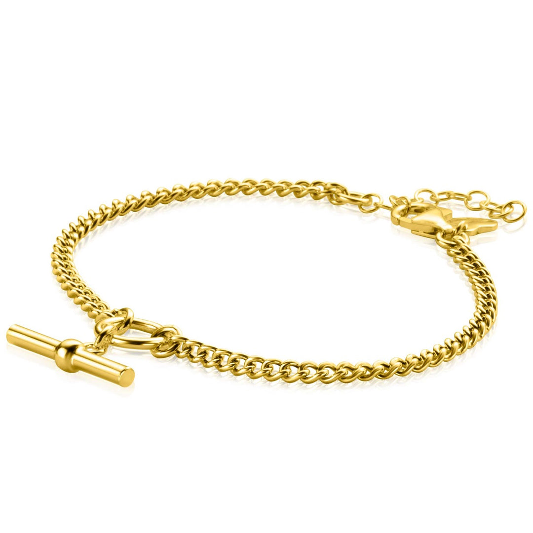 De Zinzi Armband Gold Plated Zia2359 van Zinzi heeft een trendy kapittelstokje-sluiting, waarbij het glanzende en elegante ontwerp van de armband prachtig plat op een witte achtergrond ligt.